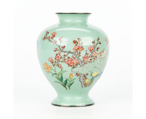 Japanese cloisonne enamel vase. Depicting blooming cherry blossoms, lilies, peonies, and many other flowers on a light teal b