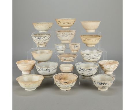 Group of 19 Chinese Yuan or Ming ceramic shipwreck bowls. Each with blue and white decoration.Height ranges from: 1 1/4 in to