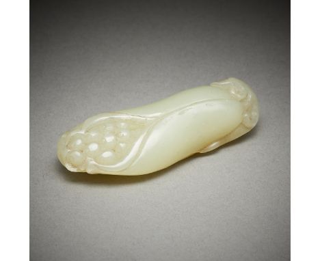 Chinese carved jade lotus flower. The petals are just beginning to open revealing the seeds within. Carved of a semi-transluc