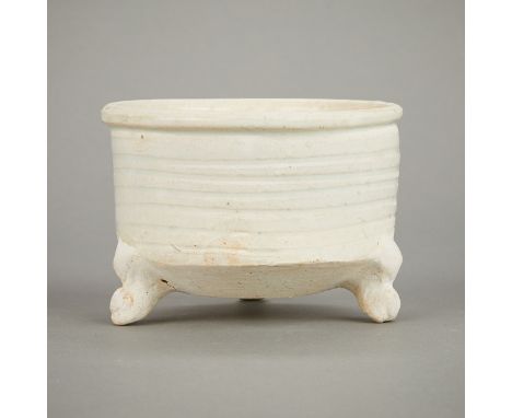 Chinese Song dynasty ceramic tripod censor with a pale white glaze. The sides decorated with shallow bands.Height: 3 1/4 in x