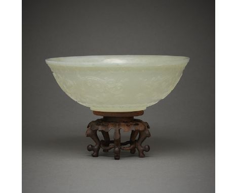 Well carved 18th century Chinese jade bowl. The thinly-carved sides with scrollwork decoration. A six character Qianlong mark