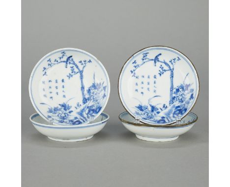 Group of four Chinese Blue de Hue blue and white porcelain dishes. Each decorated with a landscape featuring a bird perched a