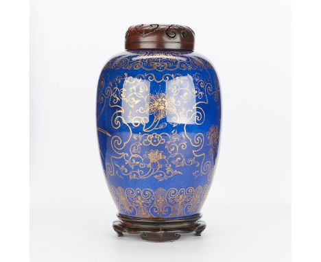 Chinese 18th century powder blue porcelain vase with a carved wooden lid and stand. Decorated with gilt floral and foliate de