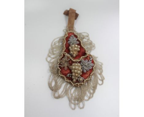 A Late 19th century Pearl Wall Hanging Decorated with Glass Beads and Pearl on a Red Material Ground 