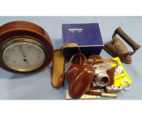A Voitlander VITO BL camera with accessories, instructions, original receipt of purchase dated 1959, in a brown case and orig