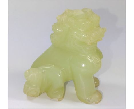 A small jade carving of a lion. 