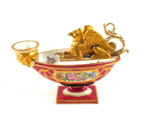 A 19th Century Sevres Imperial oil lamp, the maroon ground florally painted with gilt Gryphon and face mask decoration, lengt