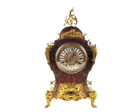 A 19th Century French waisted ebonised mantel clock with boule front and gilt metal Rococo mounts, height 24"