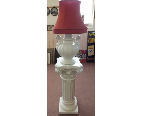 A white porcelain lamp on Corinthian column stand