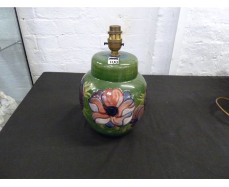 Moorcroft floral decorated table lamp with green background, height 20cm