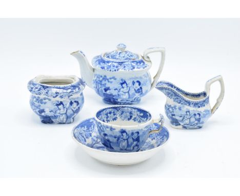 A blue and white part miniature tea set including teapot, milk and sugar (no lid), cup and deep saucer with a scene of childr