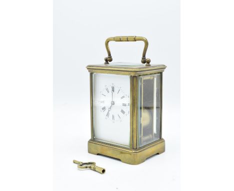 19th century brass carriage clock with two-train striking movement. When wound up, it doesn't tick, assumed not working. Stri
