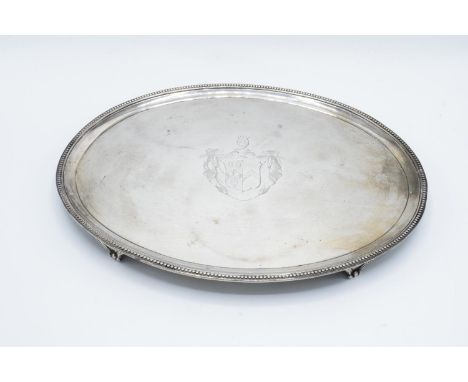 Georgian silver oval salver with an armorial crest decoration: hallmarked for London 1785 (694 grams) Some minor disfiguratio