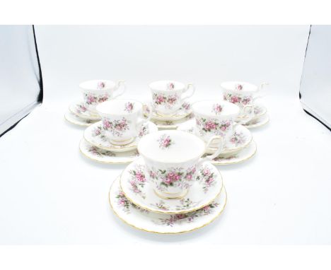 A collection of Royal Albert trios in the Lavender Rose design (6 trios) 3 cups are seconds. 2 saucers are seconds. 5 Side pl