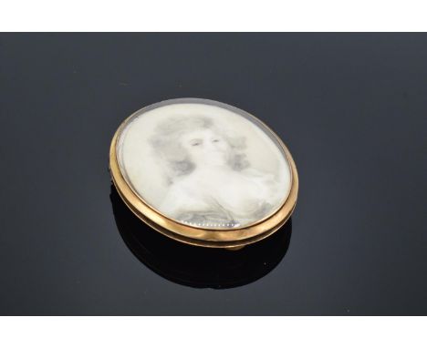 A large Victorian lockett with enamel and cut steel decoration containing a portrait together with a lock of hair: vendor bel
