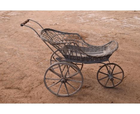 Large wicker garden cart. In good condition, a decorative item only. Some damage to the wicker and wood sections. 125cm long