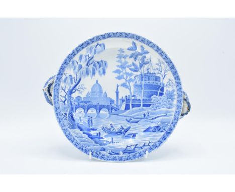 19th century Spode blue and white Italian scene hot water plate with shell stopper. There is a restored chip and underglaze c