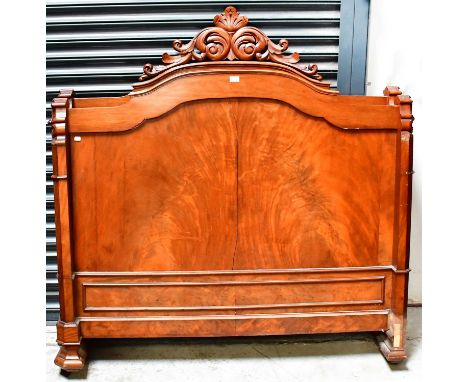 A 19th century French walnut bedstead suitable for a standard 4' 6" mattress, with contemporary home-made base.