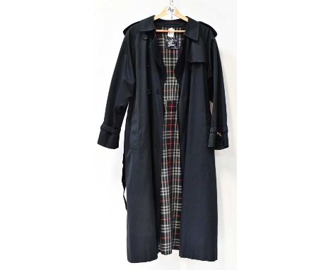 BURBERRYS; a ladies' navy blue overcoat.Condition Report: Leather buckles scuffed, but otherwise appears to be in overall goo