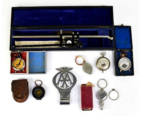 A collectors' lot with three pocket volt meters, a The Magnapole leather cased compass, an AA badge, folding lenses and a cas