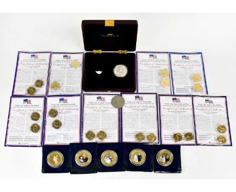 A collection of commemorative coinage to include a part set of 'The US Gold-plated Presidential Dollar's collection, 'The Que