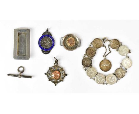 Two hallmarked silver medals, comprising an example with blue enamelled detail inscribed 'B'ham &amp; Dist Anglers Benevolent
