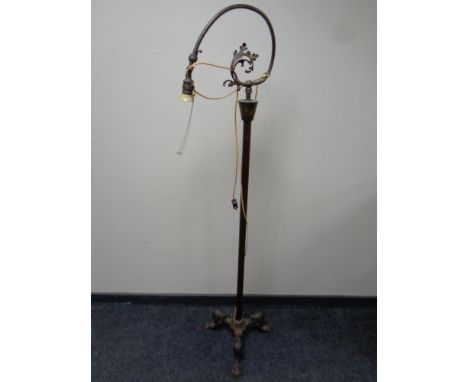 An antique cast iron rise and fall standard lamp (continental wiring)  