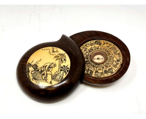 An oriental inlaid wooden compass. 