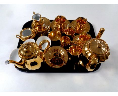A tray containing a 15 piece Wade gilt coffee service together with a further Bavarian gilt tea service  