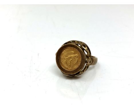 A 9ct gold ring inset with 1945 Dos Pesos coin  CONDITION REPORT: 6.5g gross