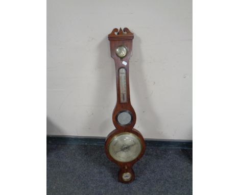 A banjo barometer with silvered dial  