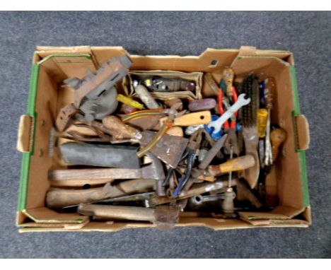 A box containing vintage hand tools and a blow lamp  