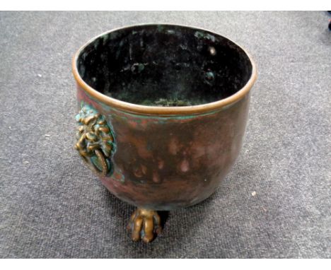 A 19th century copper lion mask planter on paw feet  