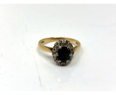 An 18ct gold sapphire and diamond ring, size O.  CONDITION REPORT: 3.9g