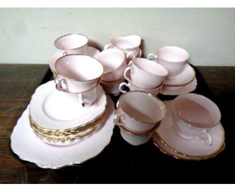 A tray containing a 39 piece English pink and gilt bone china tea service 
