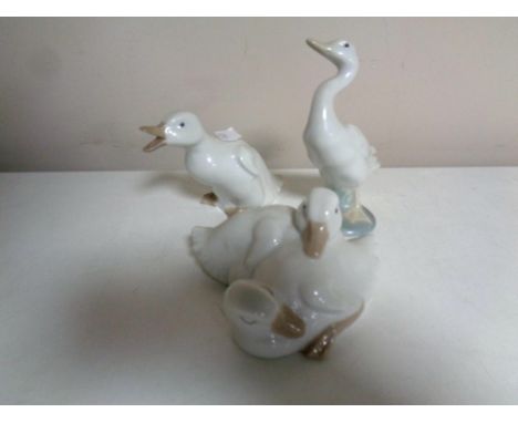 A Lladro figure of a duck together with two further Nao figures, ducks  