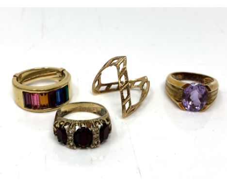 A 9ct gold ring (a/f) together with three costume rings. (4) CONDITION REPORT: 9ct gold ring broken - 2g. 