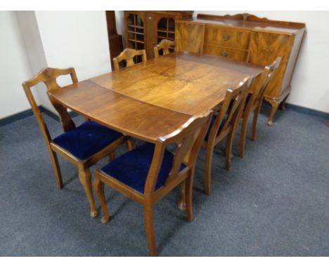 An eight piece walnut Queen Anne style dining room suite : shaped sideboard, extending table, six chairs, width 138 cm, depth