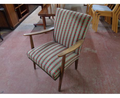 A mid 20th century armchair upholstered in a heart tapestry fabric  