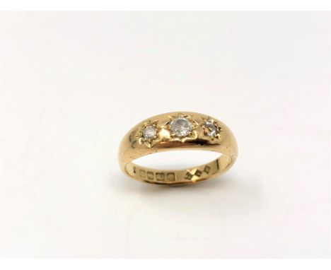 An antique 18ct gold gypsy-set three stone old-cut diamond ring, size N. 4.5g.