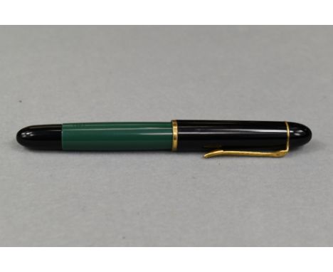 A Pelikan 120 piston fill fountain pen in green with black cap having Pelikan EF nib. Approx 12.4cm