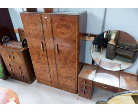 A 1930's figured walnut bedroom suite comprising double wardrobe, tall boy, dressing table, stool and double bed ends