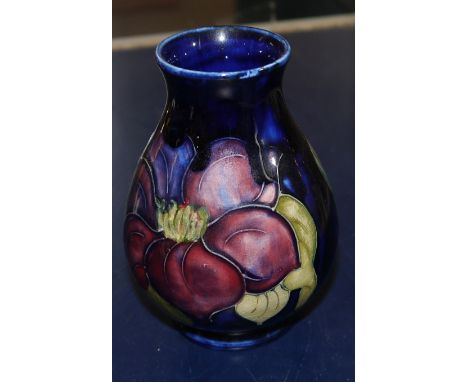 A small baluster Moorcroft vase anemone against a blue ground, ht 4"
