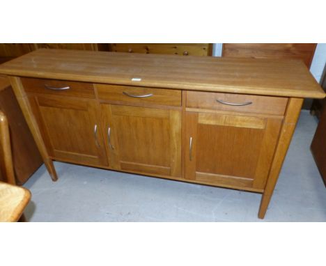 A modern light oak sideboard of 3 drawers over 3 cupboards