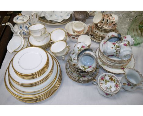 A Royal Worcester gilt bordered part dinner and tea service, 35 pieces approx; a Royal Albert style part tea set by Chodziez;