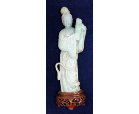 A modern Chinese jade coloured hardstone figure, female deity with scroll, on hardwood base, height 10"; 2 soapstone temple d
