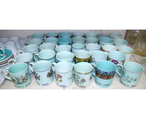 A collection of 33 annual mugs for Liberty & Co., by Adams; Poole; etc.