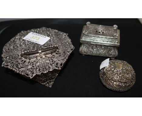 Two Continental unusual white metal filigree caskets and a similar patch box