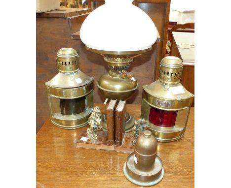 A pair of brass Port/Starboard lamps;  a WWI trench art petrol lighter made from a 12 pdr shell; a pair of bookends; an oil l