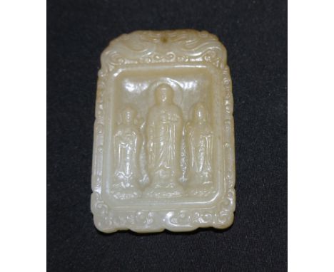 A Chinese jade pendant/plaque carved in relief with a female deity, possibly Guan Yin, and 2 children